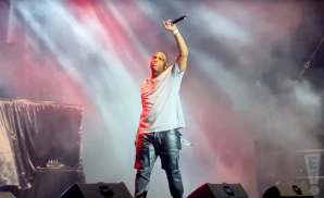nelly performing at the big e in a white shirt