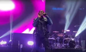 trey songz rapping on stage in a leather jacket