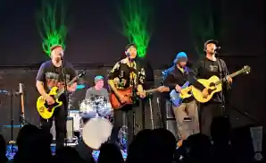 stick figure performing live on stage with kbong.