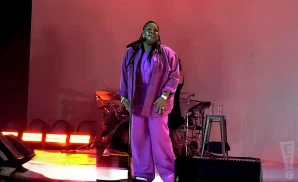 tasha cobbs leonard performing in a pink jacket at the james l knight center in miami florida