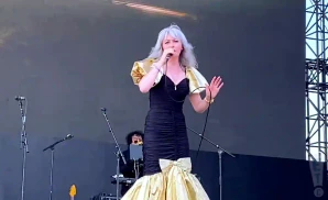 ladytron vocalist singing live in black and gold dress