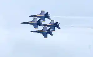 four jetplanes performing in aerial show.