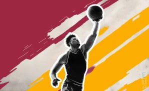a cleveland cavaliers basketball player looks down the court with a basketball in his hand