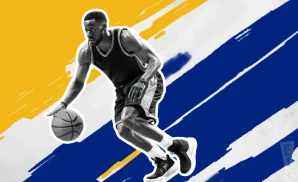 a golden state warriors basketball player looks down the court with a basketball in his hand