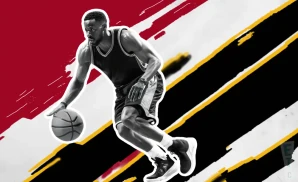 a miami heat basketball player looks down the court with a basketball in his hand