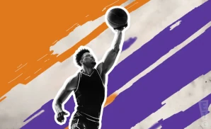 a phoenix suns basketball player jumping to tip the ball to gain possession during a game