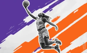 a phoenix mercury wnba basketball player jumping to dunk the ball in the basket
