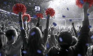 a crowd of belmont bruins fans cheering for their team
