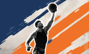 an illinois fighting illini basketball player jumping to tip the ball to gain possession during a game