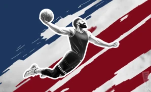 a liberty flames basketball player jumping to dunk the ball in the net