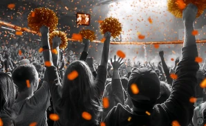 a crowd of mercer bears fans cheering for their basketball team