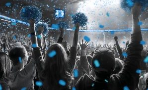 a crowd of north carolina tar heels fans cheering for their basketball team