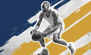 a notre dame fighting irish basketball player looking down the court and dribbling the ball