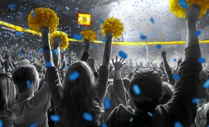 a crowd of southern jaguars fans cheering for their football team