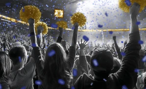 a crowd of uc davis aggies fans cheering for their basketball team