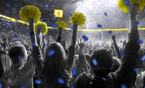 a crowd of uc san diego tritons fans cheering for their basketball team