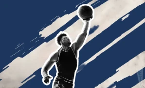 a villanova wildcats basketball player jumping to tip the ball to gain possession during a game