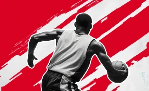 a wisconsin badgers basketball player looking down the court and dribbling the ball