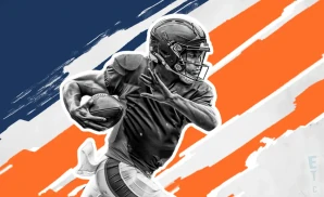 a chicago bears football player runs with the ball