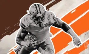 a cleveland browns football player runs with the ball