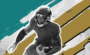 a jacksonville jaguars football player runs with the ball