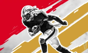 a kansas city chiefs football player runs with the ball