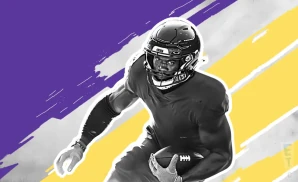 a minnesota vikings football player runs with the ball