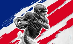 a new york giants football player runs with the ball