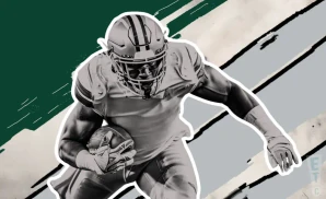 a philadelphia eagles football player runs with the ball