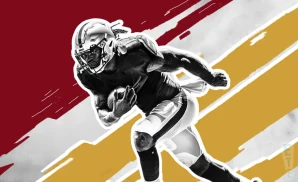 a san francisco 49ers football player runs with the ball