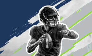 a seattle seahawks football player runs with the football