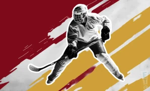 an acadie-bathurst titan ice hockey player about to hit the puck