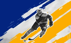 a buffalo sabres  hockey player about to hit the puck