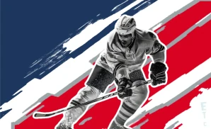 a columbus blue jackets hockey player about to hit the puck