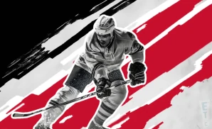 a corpus christi icerays ice hockey player about to hit the puck