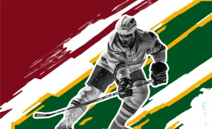 a minnesota wild hockey player about to hit the puck