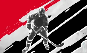 a new jersey devils hockey player about to hit the puck