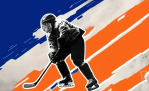 a new york islanders hockey player about to hit the puck
