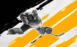 a pittsburgh penguins hockey player about to hit the puck