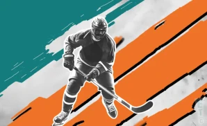 a san jose sharks hockey player about to hit the puck