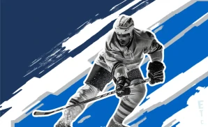 a winnipeg jets hockey player about to hit the puck