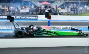 drag racing car driving at the bristol dragway in bristol, tennessee.