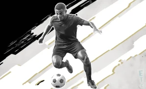 a central florida crusaders soccer player kicking the ball down the field