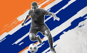 a fc cincinnati soccer player kicking the ball down field