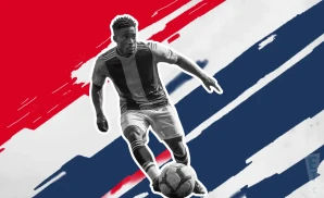 a fc dallas soccer player kicking the ball down field