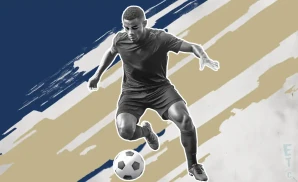 a philadelphia union soccer player kicking the ball down field