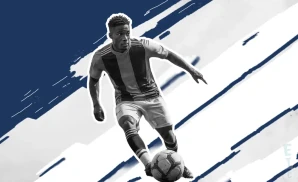 a cf monterrey soccer player kicking the ball down field