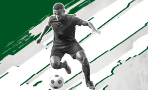 a club leon fc soccer player kicking the ball down field