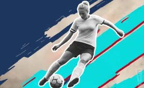 a chicago red stars soccer player kicking the ball down field