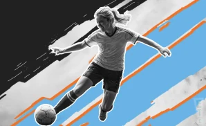 a nj ny gotham fc soccer player kicking the ball down field